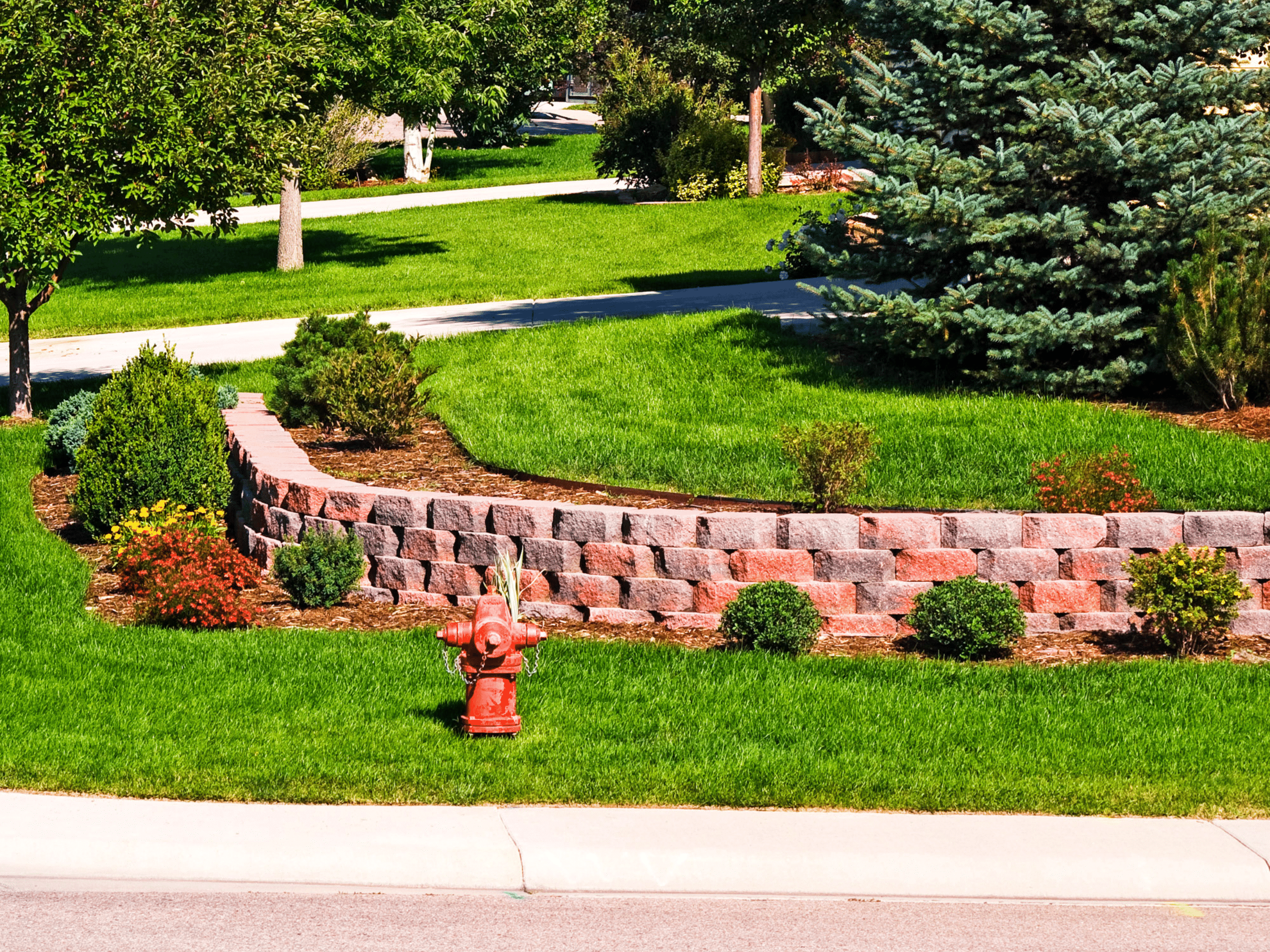 Retaining Wall Brick Stone Commercial Project Elion Landscaping and Tree Service Oklahoma